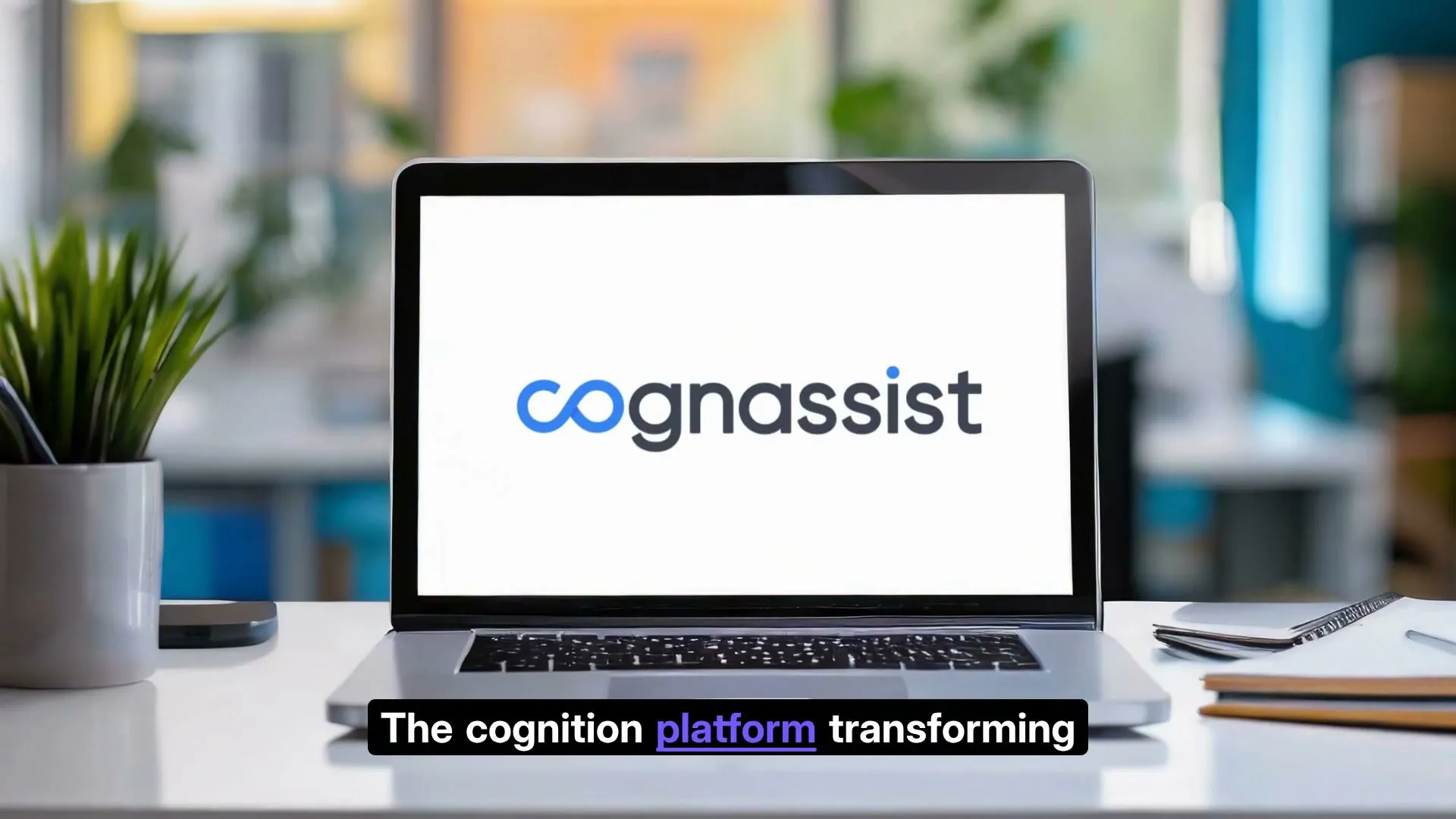 A laptop on a desk displaying the Cognassist logo